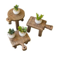 three small wooden tables with planters on each one and two smaller ones sitting on the other