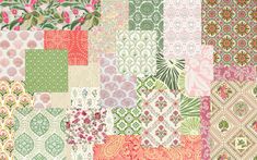 a patchwork quilt with many different colors and patterns on the fabric, including pink, green