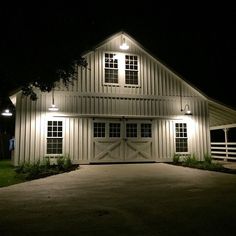 a white barn lit up at night with the words best 25 metal barn ideas on pinterest