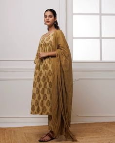 Indulge in pure elegance with our Light Brown Hand Block Printed Suit Set. Crafted from luxurious mul-mul, this set features a timeless hand block print inspired by India's finest artistry. Complete with a stunning dupatta adorned with delicate beadwork, adding a touch of sophistication to your ensemble. No. of pieces - 3 piece set. Color - Light Brown. Fabric - Mul-Mul. Washing Instructions - Dry Clean. Traditional Brown Dupatta With Printed Motifs, Block Print Dupatta Handmade, Spring Block Print Dupatta, Eid Yellow Block Print Dupatta, Unstitched Block Print Dupatta, Hand Block Printed Suits, Block Printed Suits, Printed Suit, Brown Hand