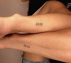 two girls with tattoos on their arms and the numbers thirteen eleven below them are both written in cursive font