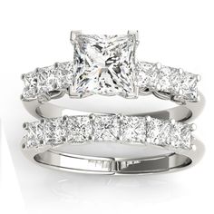 a princess cut diamond ring set with matching bands