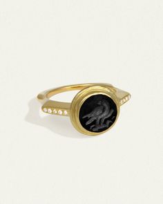 Signet ring with eagle motif in 22k solid gold, onyx intaglio & diamond. Shop Temple of the Sun Heritage Collection inspired by ancient Anatolia. Intaglio Ring, Gemstone Properties, Seal Ring, Gold Signet Ring, Gold Hand, An Eagle, Heritage Collection, Diamond Shop, 22k Gold