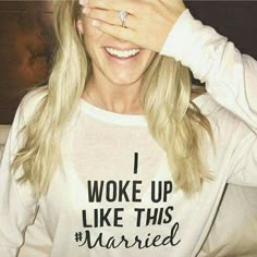 a woman holding her hands up to her face with the words i woke up like this married on it