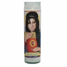 a white candle with an image of a woman holding a red apple in her hand