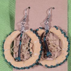 These Native American Dreamcatcher Earrings Are Vintage. Handmade With Leather, Glass Beads, And I Believe Catgut (Intestines). Glass Beads Are Turquoise Green And Black. I Have Put Them On New Cardstock, Rubber Earring Backs, And Archival Sleeve. I'm Not Sure They Were Ever Worn As They Are In Such Nice Condition. These Are An Estate Item From Here In The Southwest. Please Reach Out If You Have Any Questions. We Are A Smoke-Free And Pet Friendly Home. Items Are Cleaned As Able And Stored In Plastic Away From Pets Until They Are Shipped. Thank You Artisan Brown Beaded Earrings For Pierced Ears, Artisan Brown Beaded Nickel-free Earrings, Handmade Beige Dangle Jewelry, Traditional Beaded Beige Jewelry, Beige Handmade Dangle Jewelry, Bohemian Brown Beaded Round Earrings, Beige Bohemian Jewelry, Nickel-free Brown Beaded Earrings For Festival, Traditional Handmade Beige Jewelry