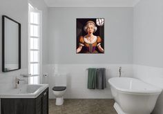 a white bath tub sitting next to a bathroom sink under a painting on the wall