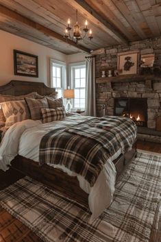 a bedroom with a bed, fireplace and windows in the room that has stone walls