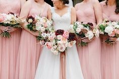 the bride and her bridesmaids are holding their bouquets in front of each other