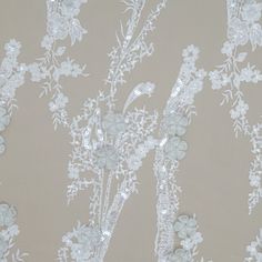 white lace with flowers and leaves on a beige background