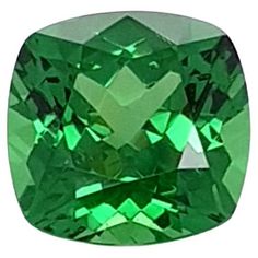 an emerald green square cut gems