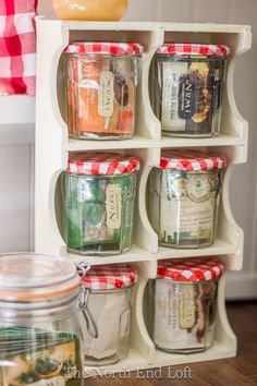 an organized spice rack with jars on it