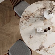 a marble table with two chairs around it