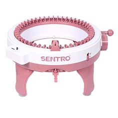 a pink and white machine with spikes on it's legs that says sentro