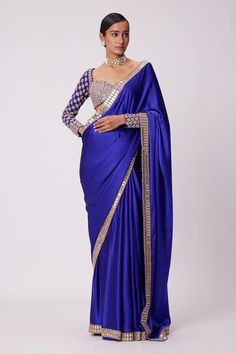 Persian blue saree crafted in satin with mirror bahar embroidery on the border. Paired with a long sleeves sweetheart neck blouse with fleur mirror-cutdana embroidery. - Aza Fashions Long Sleeves Blouses For Sarees, Saree Blouse Long Sleeve, Long Sleeve Saree Blouse, Long Sleeve Blouse Designs, Mirror Saree, Saree Satin, Sweetheart Neck Blouse, Vani Vats, Cutdana Embroidery