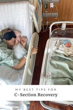 a woman laying in a hospital bed next to a baby with a blindfold on