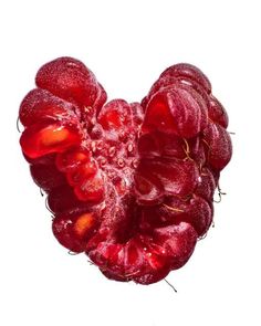 a red flower is shown in the shape of a heart on a white background with water droplets