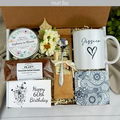 a gift box filled with coffee, tea and other items for someone's birthday