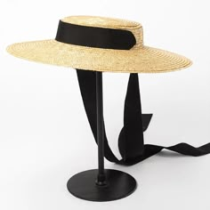 Complete your summer look with our Wide Brim Straw Boater Hat, a timeless accessory for sunny days. Crafted from straw, this boater hat features a wide brim that offers stylish sun protection. Perfect for beach outings or picnics, its classic design adds a touch of vintage charm to any outfit. Chic Spring Boater Hat Made Of Paper Straw, Spring Vacation Straw Boater Hat, Chic Straw Boater Hat For Beach, Flat Brim Paper Straw Boater Hat For Beach, Flat Brim Paper Straw Boater Hat For Beach Season, Spring Vacation Boater Hat In Paper Straw, Chic Straw Boater Hat For Beach Season, Summer Boater Hat With Flat Brim For Beach Season, Summer Beach Boater Hat With Flat Brim