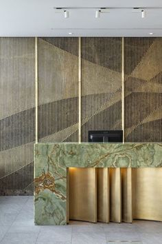 an elegant lobby with gold and green marble