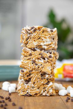 three bars stacked on top of each other with marshmallows and chocolate chips