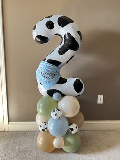 the number two is made out of balloons and has a dalmatian theme on it