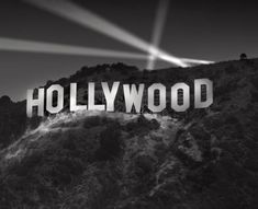 the hollywood sign is lit up in black and white