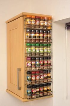 a spice rack mounted to the side of a wall