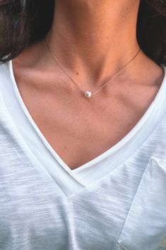 Dainty and minimal, pearl necklace. Designed with the skinniest chain that creates a modern and simple statement. This single necklace is tarnish free and meant to last with the proper love and care. Gold dipped chain and shiny, rounded, pearl. Minimalist White Chain Necklace With Pearl Pendant, Minimalist White Pearl Necklace For Everyday Wear, Simple Pearl Necklace As Gift, Minimalist White Pearl Necklace For Everyday, Minimalist White Chain Necklace For Everyday, Minimalist White Beaded Pearl Necklace, Minimalist Everyday White Pearl Necklace, Everyday Pearl Necklace With Pendant, Chic Chain Necklace With Pearl Pendant