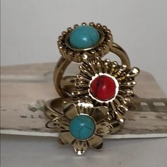 Gold Tone Rings With Turquoise And Coral Accent Detail. Trendy Turquoise Ring, Trendy Turquoise Ring Jewelry, Turquoise Metal Rings As A Gift, Turquoise Metal Rings For Gifts, Turquoise Rings Suitable As Gifts, Turquoise Metal Rings For Gift, Multicolor Metal Bohemian Rings, Bohemian Multicolor Metal Rings, Nickel-free Turquoise Metal Rings