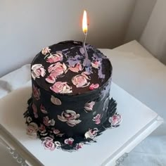 a birthday cake with a single candle on it