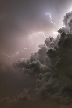 a large cloud filled with lots of lightning