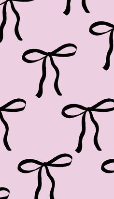 a pink background with black bows on it