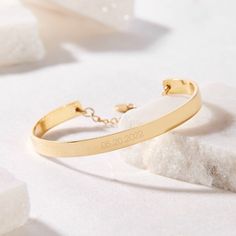 Preserve a special day forever with the Gwen Date Cuff Bracelet. Personalize your cuff with your choice of dates and choose between rose gold, yellow gold, or rhodium plating options for a completely unique piece. A lovely gift for graduations, engagements, anniversaries, and birthdays! Available in 14k gold plated, rhodium plated or 14k rose gold plated brass Width: 1/4" Length: 5 1/2" Made in the USA With engraving this item is FINAL SALE SKU: BYB1034 Elegant Engraved Cuff Bracelet For Personalized Gift, Elegant Engraved Cuff Bracelet As Personalized Gift, Engraved Cuff Bracelets For Anniversary, Engraved Rose Gold Cuff Bangle Bracelet, Engraved Rose Gold Bangle Cuff Bracelet, Engraved Rose Gold Cuff Bangle, Elegant Personalized Adjustable Cuff Bracelet, Elegant Customizable Bracelets For Promise, Modern Engraved Rose Gold Bracelets