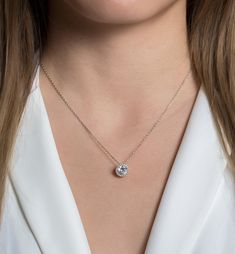 The perfect to give to your Bridesmaid or Bridal party! Give your bridesmaid a gift that she can wear everyday. .925 Sterling Silver Cubic Zirconia pave crystals Hypoallergenic, lead, and nickel free Pendant Diameter: 0.4in (1cm) Chain Length: 16in (40cm) + Extension: 2in (5.1cm) Lobster clasp closure #N430 Dainty Jewelry With Sparkling Round Cut Stones, Delicate Silver Solitaire Necklace, Delicate Silver Solitaire Necklace Cubic Zirconia, Elegant Sparkling Round Cut Necklaces, Elegant Sparkling Round Necklace, Elegant Sparkling Round Cut Necklace, Elegant Cubic Zirconia Necklace For Bridesmaid, Elegant Crystal Solitaire Necklace With Diamond Cut, Delicate Cubic Zirconia Jewelry With Halo Setting