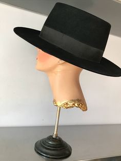 "Hard structure black felt hat. Seems to be an early hat, maybe as early as the 1930's. In good vintage condition. Measurements are: Circumference21\" Dome4\" Brim3\" Feel free to convo me with any further questions. Thank you for your interest." Black Formal Boater Hat With Flat Brim, Formal Black Boater Hat With Flat Brim, Classic Black Short Brim Costume Hats And Headpieces, Classic Black Costume Hats And Headpieces With Short Brim, Black Classic Costume Hat With Short Brim, Classic Black Costume Hat With Short Brim, Classic Black Costume Hats With Short Brim, Black Hat Bands For Evening With Short Brim, Black Flat Brim Felt Hat For Formal Occasions