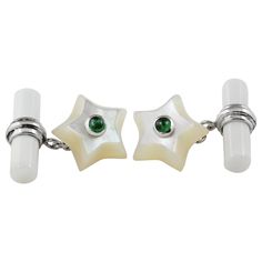 This charming pair of cufflinks is entirely made in mother of pearl, hand carved as stars and adorned in the center with cabochon emerald. The 18 karat white gold post links this element to the toggle, which is a simple cylinder. Dimensions: 1.4x1.4 cm circa 0.58x0.58 inches circa All AVGVSTA jewelry is new and has never been previously owned or worn. Each item will arrive beautifully gift wrapped in a AVGVSTA box, put inside an jewel box and with a elegant pouch with an expertise with the descr Gold Star Mother, Elegant Pouch, Jewel Box, Mother Pearl, Gold Star, Gold Stars, Jewellery And Watches, Pearl White, Mother Of Pearl