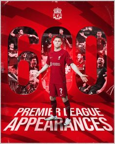 a man standing in front of a red poster with the number 90 on it's side