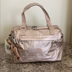 Nwt Rose Gold Color Has 2 Side Pockets 1 Zippered Pocket In The Front And Another 1 In The Back Adjustable Crossbody Strap I Have 3 Colors Available! Modern Pink Satchel For Gift, Rose Gold Bags For Everyday Use, Small Duffle Bag, Grey Crossbody Bag, Metallic Handbags, Mini Crossbody Purse, Kipling Bags, Grey Bag, Crossbody Bags For Travel