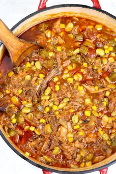 a pot filled with meat and vegetables on top of a counter