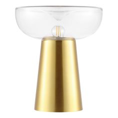 a gold colored table lamp with a clear glass bowl on the top and a metal base