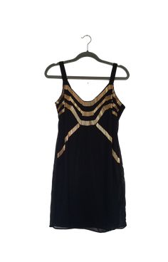 Channel your inner flapper girl, and try this one on for size, see! This tunic is beautifully embellished with golden tube beads over black lined chiffon.Polyester chiffon, gold plated beadsMade by: Ark & Co.Dry clean Glamorous Gold Flapper Dress For Summer, Gold Sequin Flapper Dress For Summer, Gold Sequin Summer Flapper Dress, Gold Flapper Dress For Summer, Gold Sleeveless Flapper Dress For Night Out, Gold Sleeveless Flapper Dress For Party Season, Gold Sleeveless Flapper Dress For Evening, Gold Sleeveless Evening Flapper Dress, Gold Sequin Flapper Dress For Night Out