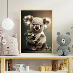 a baby koala bear holding eucalyptus leaves in front of a black and white photo