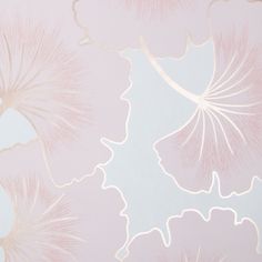 a pink and white wallpaper with large leaves on the top right hand corner in front of it