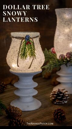 two white candle holders with pine cones on them and the words dollar tree snow lanterns