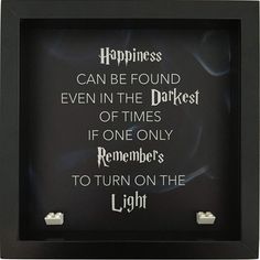 a black frame with white writing on it that says happiness can be found even in the darkest of times if one only remembers to turn on the light