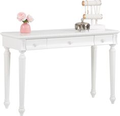 a white desk with drawers and a pink vase on the top, sitting next to a pair of scissors