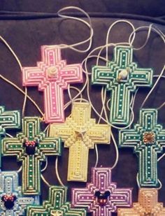 cross ornaments are displayed on a table