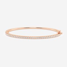 Classic and timeless, this round cut lab grown diamond bangle is the perfect gift for Valentine's Day, Birthday, Mother's Day or simply to appreciate your loved one. Set in solid gold with a side clasp for extra security, this will soon become a wardrobe staple for anyone you gift it to! Rose Gold Bracelets With Single Cut Diamonds, Classic Rose Gold Bangle With Single Cut Diamonds, Rose Gold Brilliant Cut Bangle As Gift, Rose Gold Diamond Bangle With Vvs Clarity, Rose Gold Bangle With Single Cut Diamonds, Rose Gold Brilliant Cut Bangle In Fine Jewelry Style, Classic Rose Gold Bangle With Diamond Accents, Fine Jewelry Rose Gold Bangle With Brilliant Cut, Pave Bangle