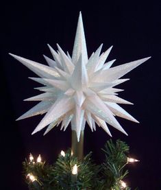 a christmas tree topper with lights on it